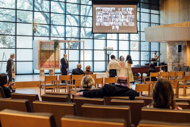 Irene Sibaja is escorted into Stern Chapel by her children at her wedding ceremony