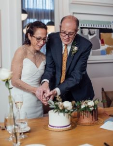 Hal Karp and Irene Sibaja cut their wedding cake